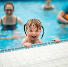 Pre-School Swimming Lessons (Child Holding Side Looking Over the Edge)