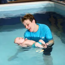 Baby Swimming Lessons (Teacher Holding Baby)