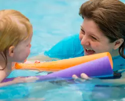 Pre-School Swimming Lesson (Woggles and Teacher)