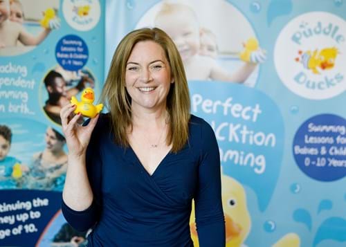 Lizzie Moore holding a Puddle Duck toy