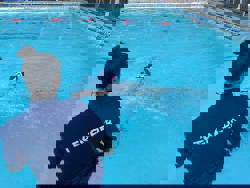 Teacher in water during swimming lessons